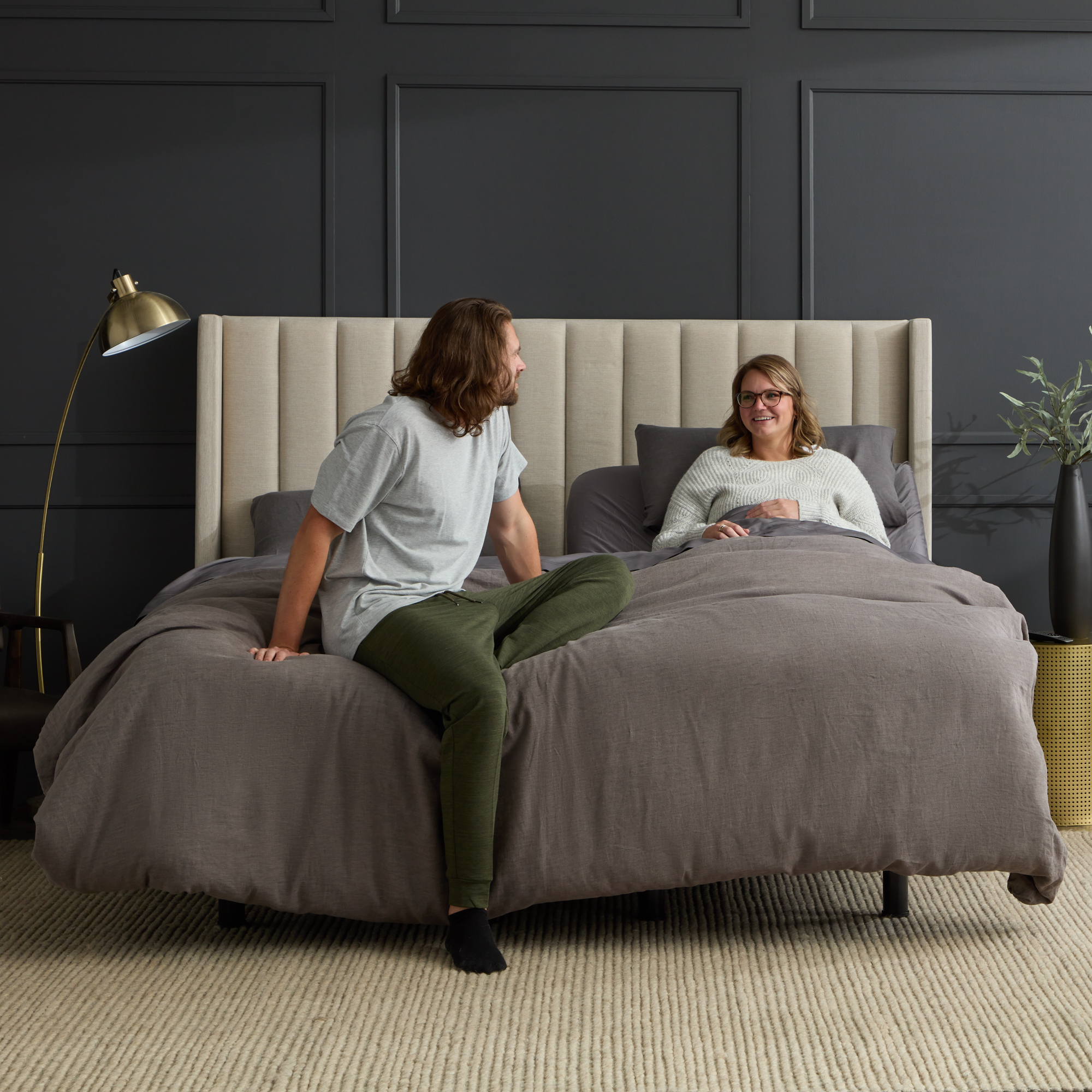 Two people sitting in bed